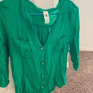 Green thread and needle blouse